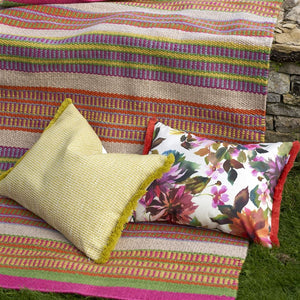 Designers Guild Manchu Fuchsia Outdoor Cushion on Mahakam Coral Outdoor Rug