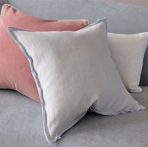Designers Guild Brera Lino Sky & Cloud Linen Cushion On Sofa