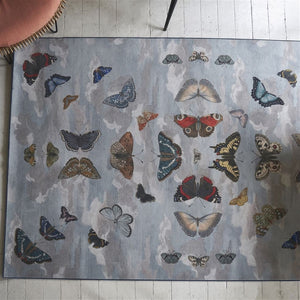 John Derian Mirrored Butterflies Sky Rug on Painted Wood Floor