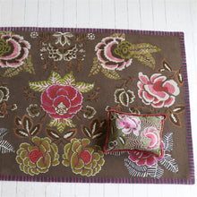 Load image into Gallery viewer, Designers Guild Rose de Damas Embroidered Cranberry Cushion on top of Matching Area Rug