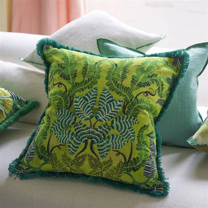 Brocart Décoratif Embroidered Lime Cushion, by Designers Guild showing reverse on couch
