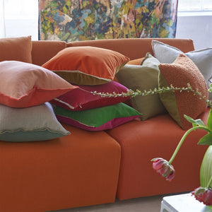 Varese Zinnia & Ochre Cushion, by Designers Guild with other throw cushions on sofa