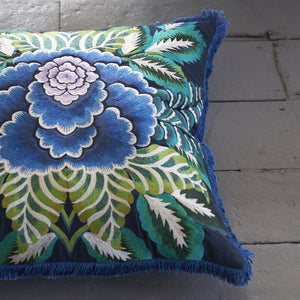 Designers Guild Rose de Damas Embroidered Indigo Cushion on painted wood floor