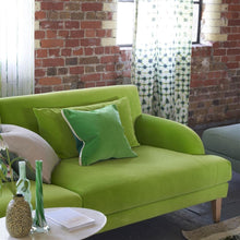 Load image into Gallery viewer, arese Viridian &amp; Apple Cushion, by Designers Guild on green velvet Designers Guild Alba sofa