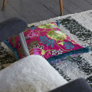 Designers Guild Brocart Décoratif Embroidered Cerise Cushion on area rug