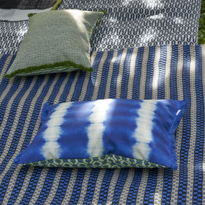 Designers Guild Pompano Grass Outdoor Cushion on Outdoor Rug Muara
