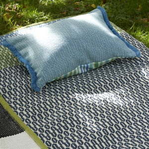 Designers Guild Pompano Aqua Outdoor Cushion on Area Rug