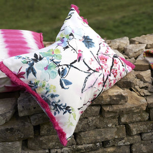 Designers Guild Chinoiserie Peony Flower Outdoor Cushion on stone wall