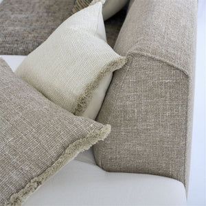 Designers Guild Charroux Natural and Chalk Cushions on Boucle Sofa