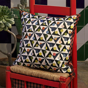 Christian Lacroix Mila Tomate Cotton Cushion on red chair