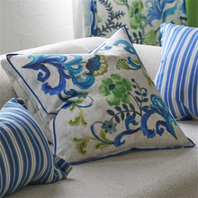 Load image into Gallery viewer, Detail view of blue and green floral cushion next to striped cushions