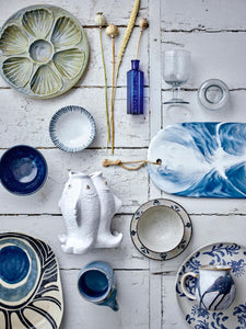 Fili_Fish White_Stoneware_Vase_Lying_on_Table