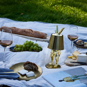 Portable LED Hiding Bunny Table Lamp, Gold on Picnic Blanket 