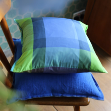 Load image into Gallery viewer, Designers Guild Brera Lino Lagoon &amp; Marine Linen Cushion On Chair