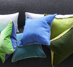 Varese Ocean & Duck Egg Velvet Cushion, by Designers Guild on sofa